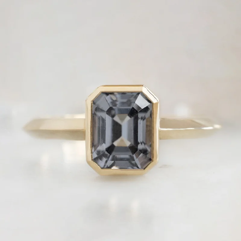 emerald-cut engagement ring halo The Hazel Ring | 1.72ct Emerald Cut Spinel in 14K Yellow Gold